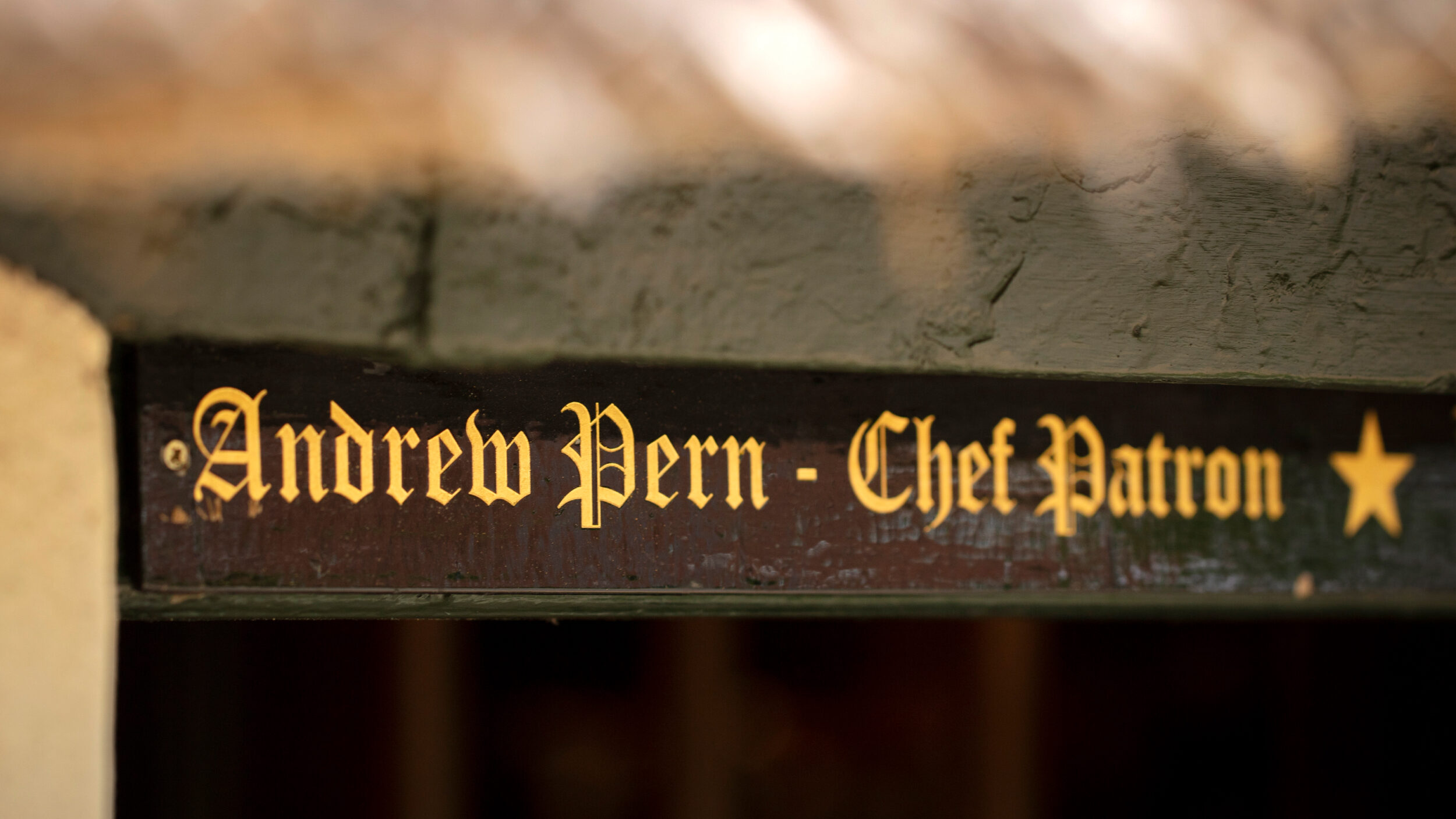 Andrew Pern lettering on beam
